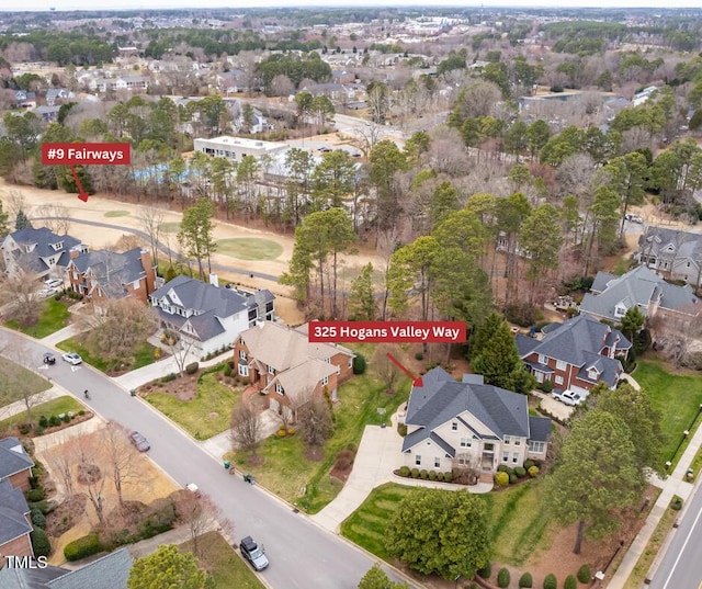 birds eye view of property with a residential view