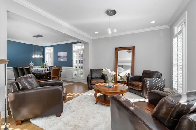 living area featuring recessed lighting, visible vents, crown molding, and wood finished floors