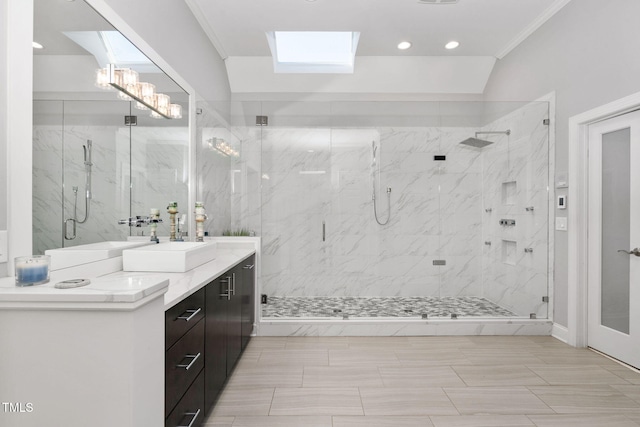 full bath featuring a skylight, a marble finish shower, crown molding, and vanity