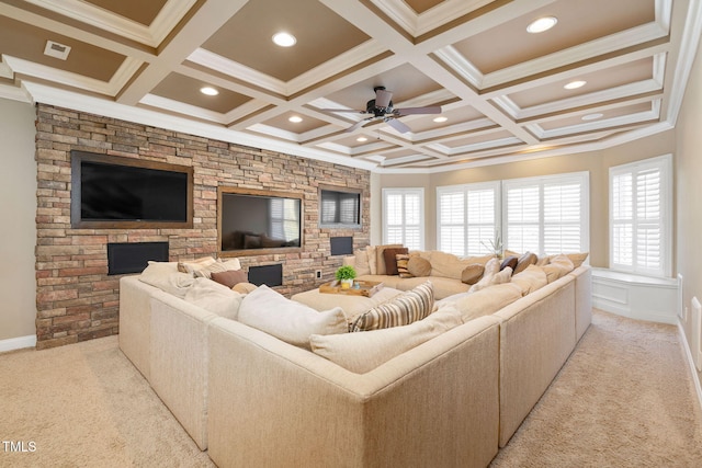 living area featuring light carpet, ornamental molding, coffered ceiling, and a healthy amount of sunlight