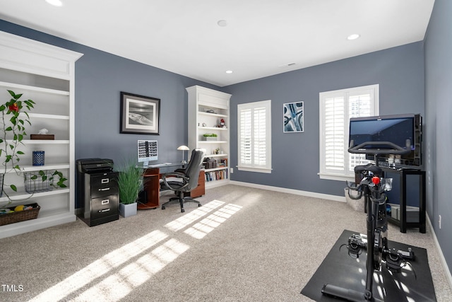 carpeted office space with recessed lighting and baseboards