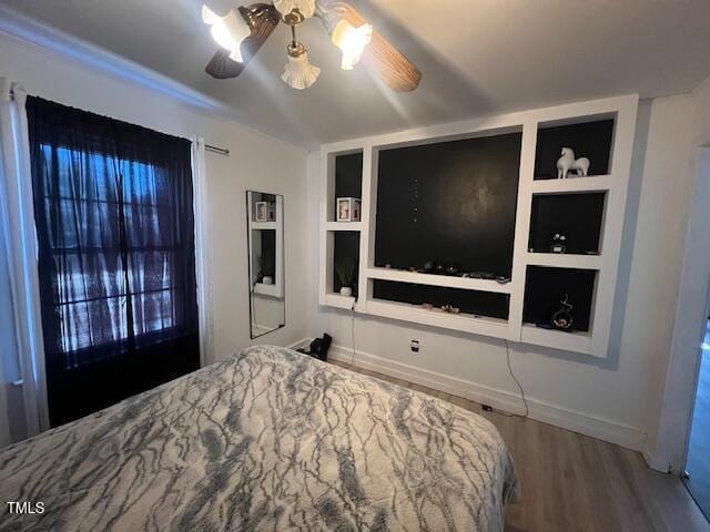 606 N Orange Ave, Dunn, NC 28334 - bedroom featuring a ceiling fan, baseboards, and wood finished floors