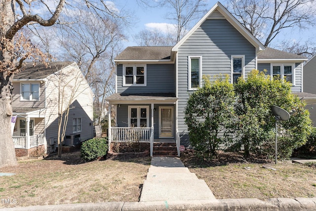 traditional-style home featuring covered porch