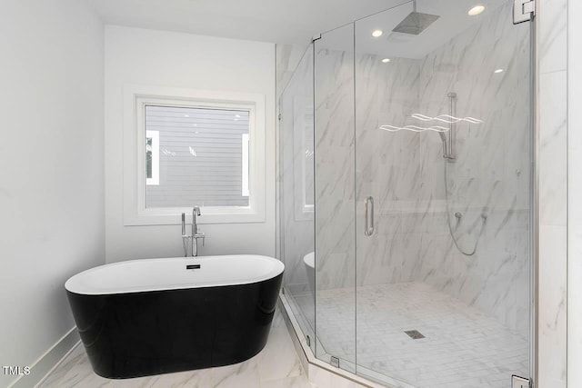 bathroom with a marble finish shower, baseboards, a soaking tub, marble finish floor, and recessed lighting