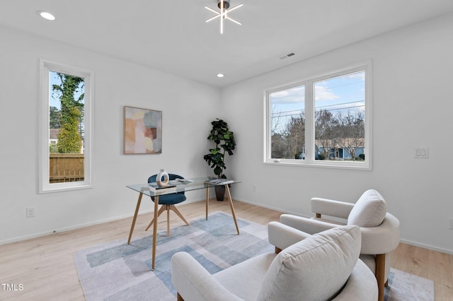 office with light wood finished floors, recessed lighting, visible vents, and baseboards