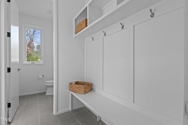 mudroom featuring tile patterned flooring and baseboards