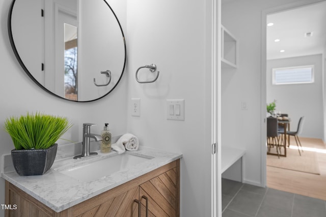 bathroom with recessed lighting, tile patterned flooring, and vanity