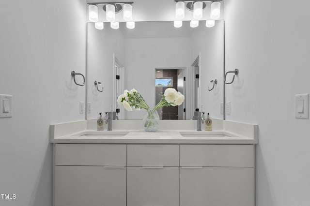 bathroom with double vanity and a sink