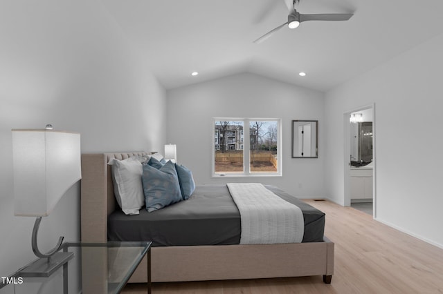 bedroom featuring lofted ceiling, recessed lighting, connected bathroom, wood finished floors, and baseboards