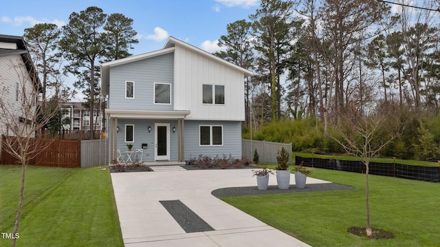 view of front of property with fence and a front yard