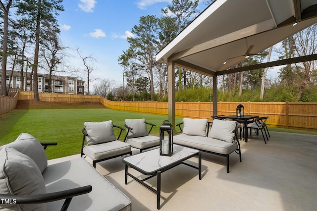 view of patio / terrace featuring a ceiling fan, outdoor dining space, a fenced backyard, and an outdoor hangout area