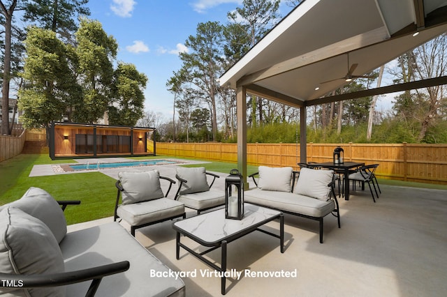 view of patio with a fenced in pool, outdoor lounge area, ceiling fan, and a fenced backyard