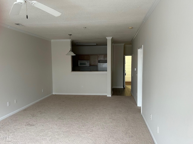 unfurnished living room with ornamental molding, visible vents, light carpet, and a textured ceiling