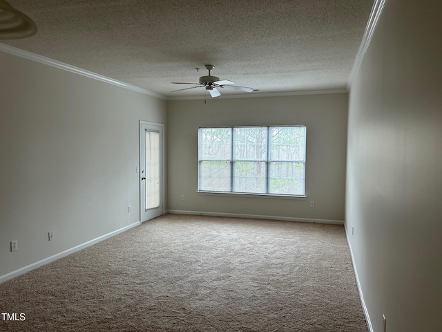 carpeted empty room featuring ornamental molding, ceiling fan, a textured ceiling, and baseboards