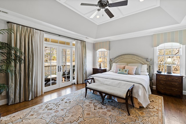 bedroom with coffered ceiling, wood finished floors, access to exterior, crown molding, and french doors