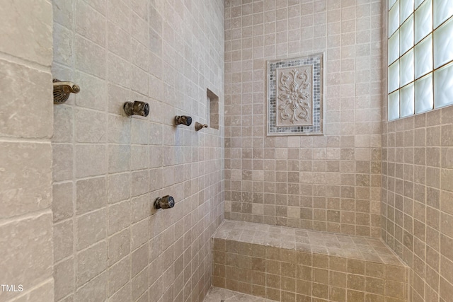 bathroom featuring tiled shower