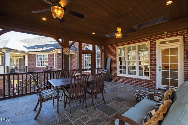 view of patio / terrace with a ceiling fan and outdoor dining space