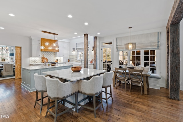 dining room featuring dark wood-style floors and recessed lighting