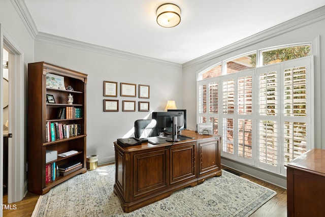 office area with light wood-style flooring and crown molding