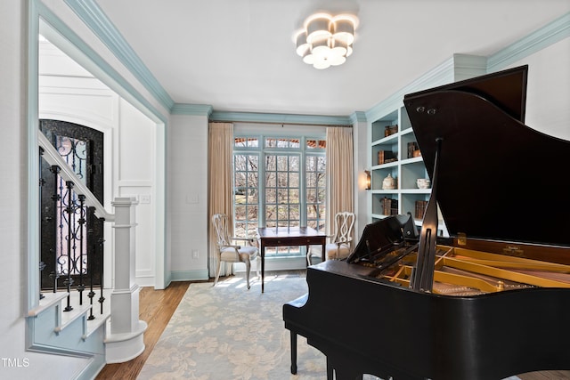 interior space featuring ornamental molding and wood finished floors