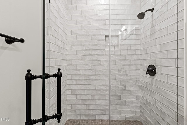 bathroom with a tile shower