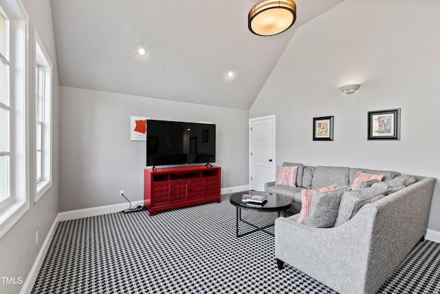 carpeted living room with high vaulted ceiling, baseboards, and recessed lighting