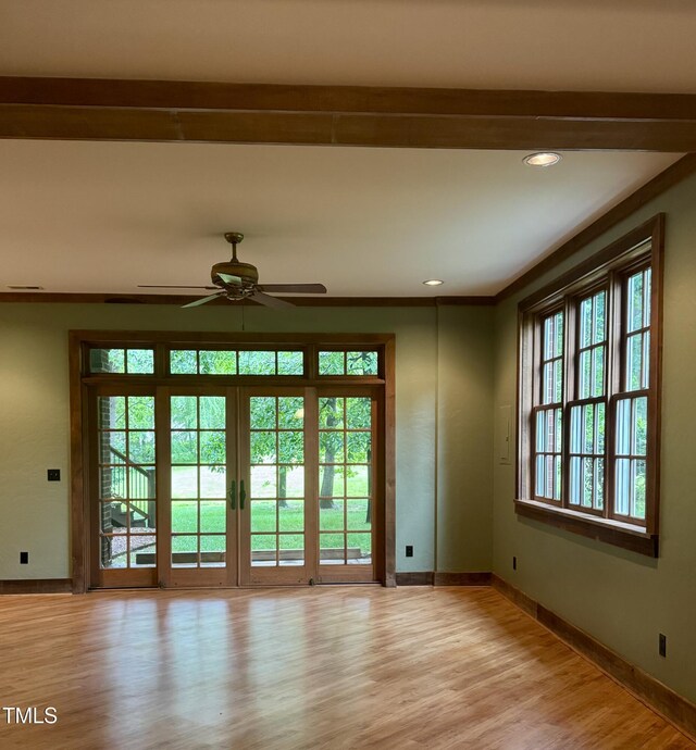 doorway featuring light wood finished floors, baseboards, a ceiling fan, and recessed lighting