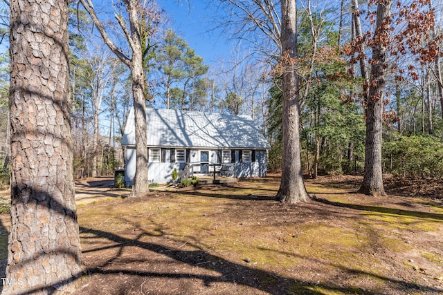 cape cod house with metal roof