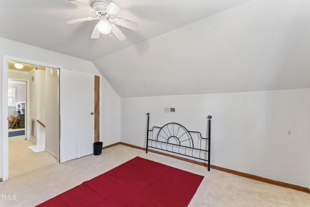 additional living space with baseboards, visible vents, lofted ceiling, ceiling fan, and carpet floors