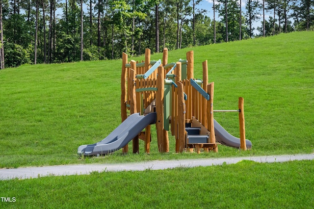 community play area with a lawn