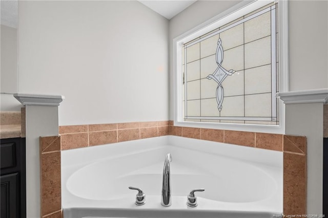 bathroom featuring a tub and vanity