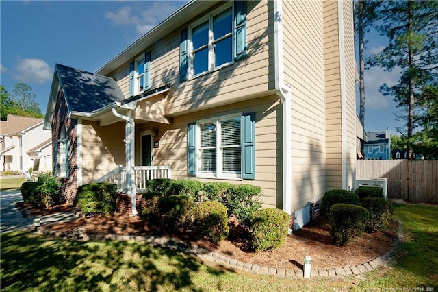 view of front of property featuring fence