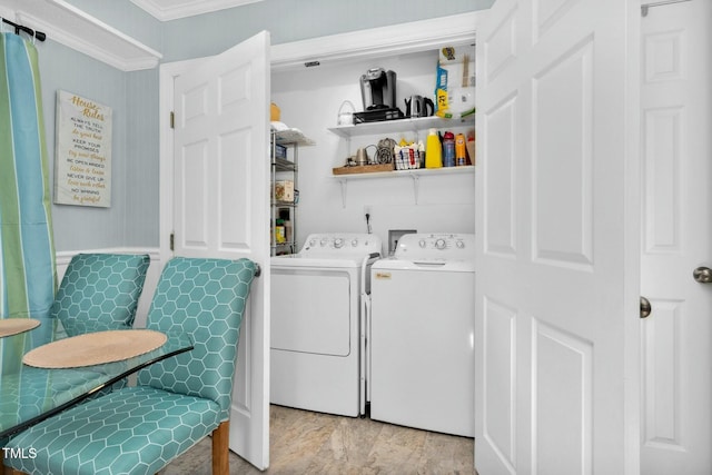 washroom with laundry area, ornamental molding, and separate washer and dryer