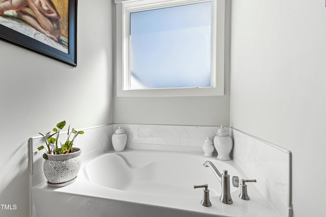 bathroom with a garden tub