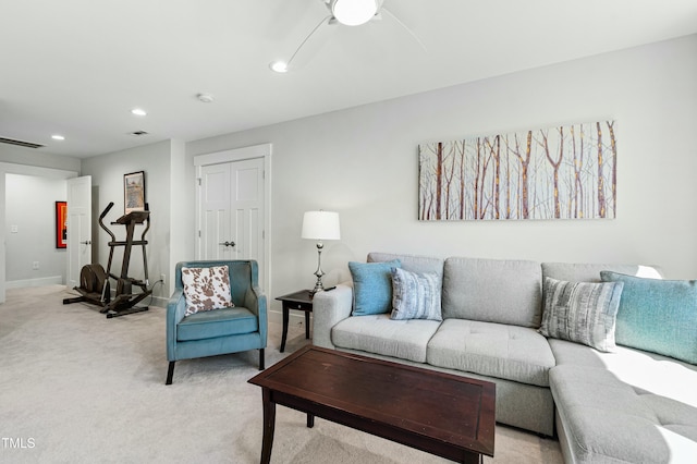 living room featuring light carpet, baseboards, visible vents, a ceiling fan, and recessed lighting