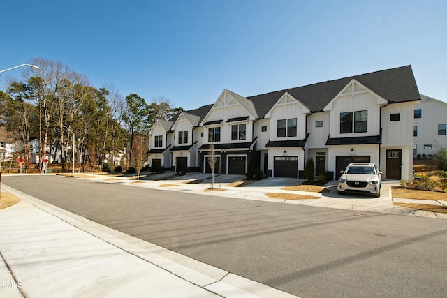 view of street featuring street lighting, a residential view, curbs, and sidewalks