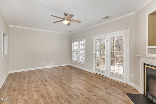 unfurnished living room with light wood-type flooring, a fireplace with flush hearth, visible vents, and ornamental molding