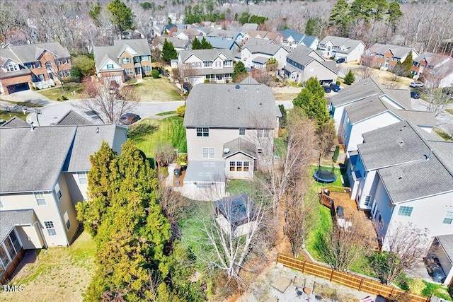 birds eye view of property with a residential view