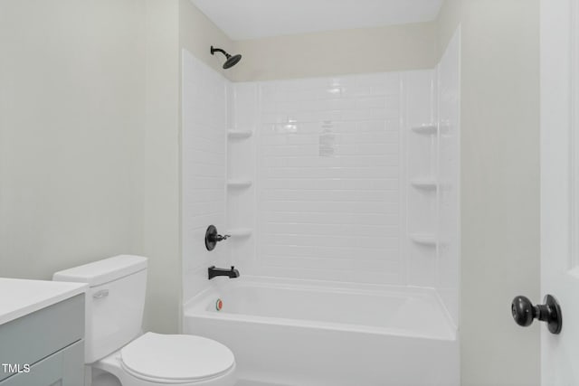 full bathroom featuring bathtub / shower combination, vanity, and toilet