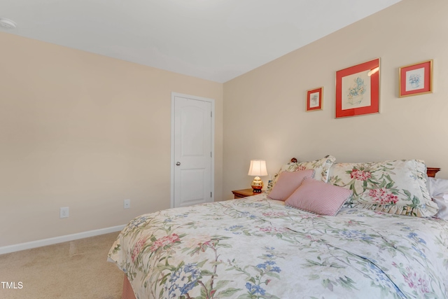 bedroom featuring carpet floors and baseboards