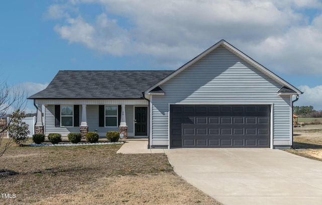 view of front of home with an attached garage, a porch, and concrete driveway