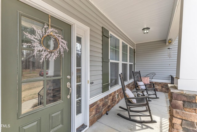 view of patio featuring a porch