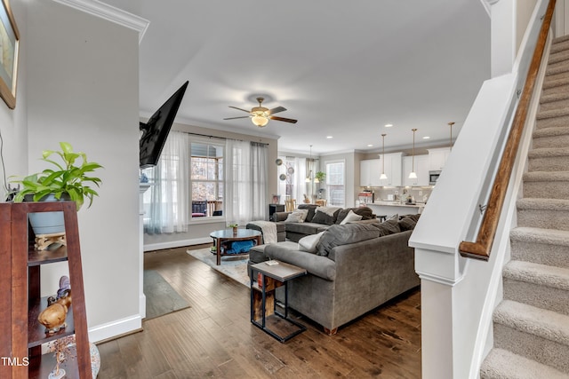 living room with dark wood-style floors, ceiling fan, stairs, crown molding, and recessed lighting