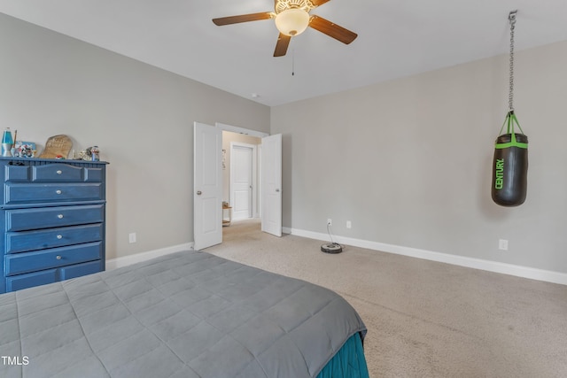 bedroom featuring ceiling fan, carpet flooring, and baseboards