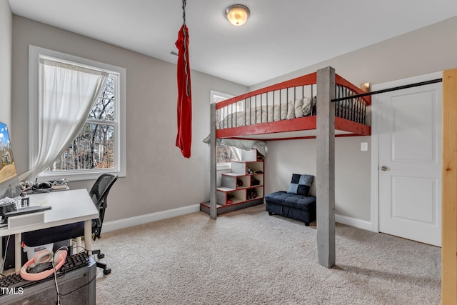 bedroom featuring carpet flooring and baseboards