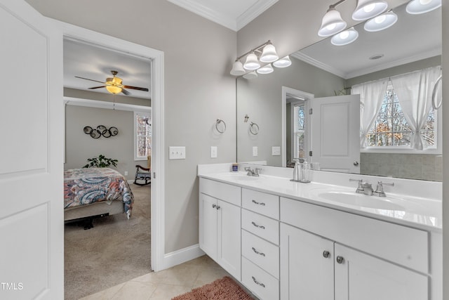 full bathroom featuring a wealth of natural light, crown molding, tile patterned flooring, and a sink