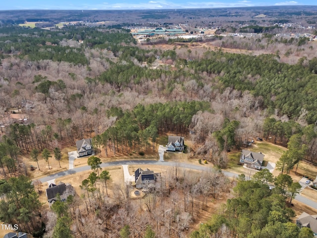 aerial view with a wooded view