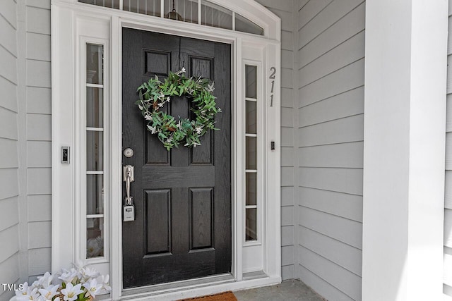 property entrance with covered porch