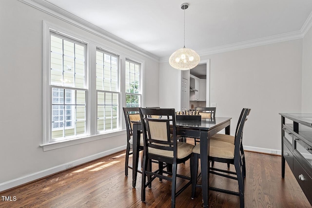 dining room featuring crown molding, baseboards, and dark wood-type flooring