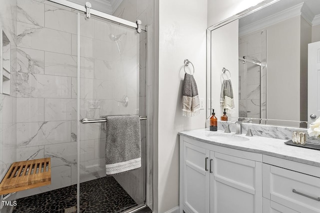 full bath featuring ornamental molding, a shower stall, and vanity